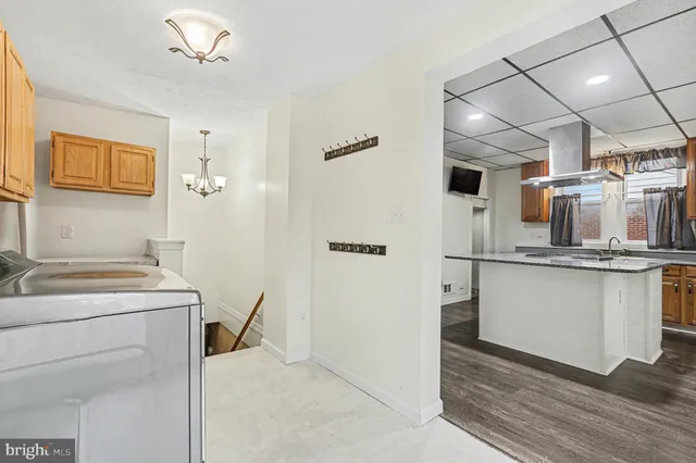 a kitchen with a refrigerator and countertop