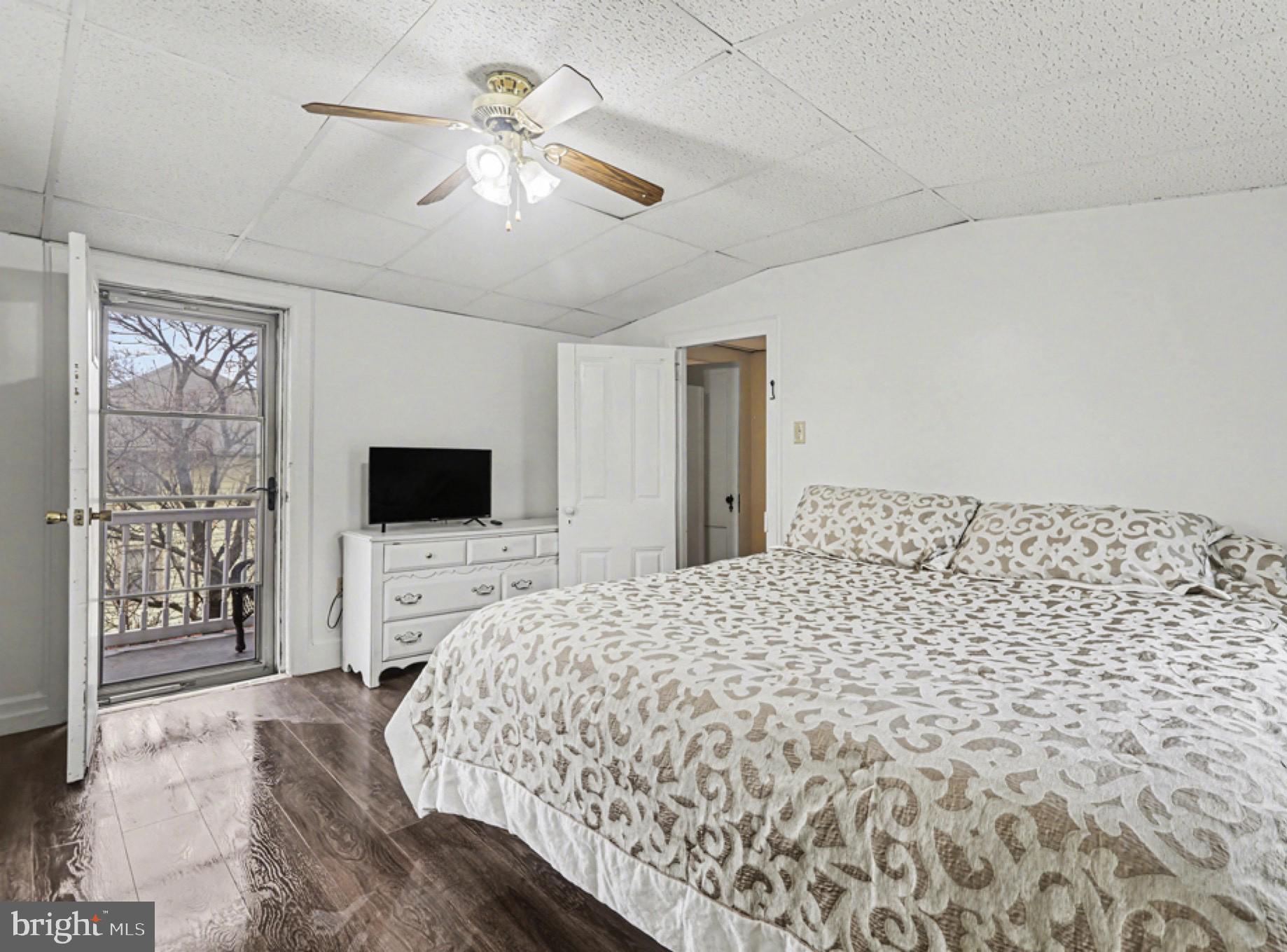 458 Highland Street Harrisburg, PA 17113 - Photo 17 of 31 a bedroom with a large bed and a flat screen tv