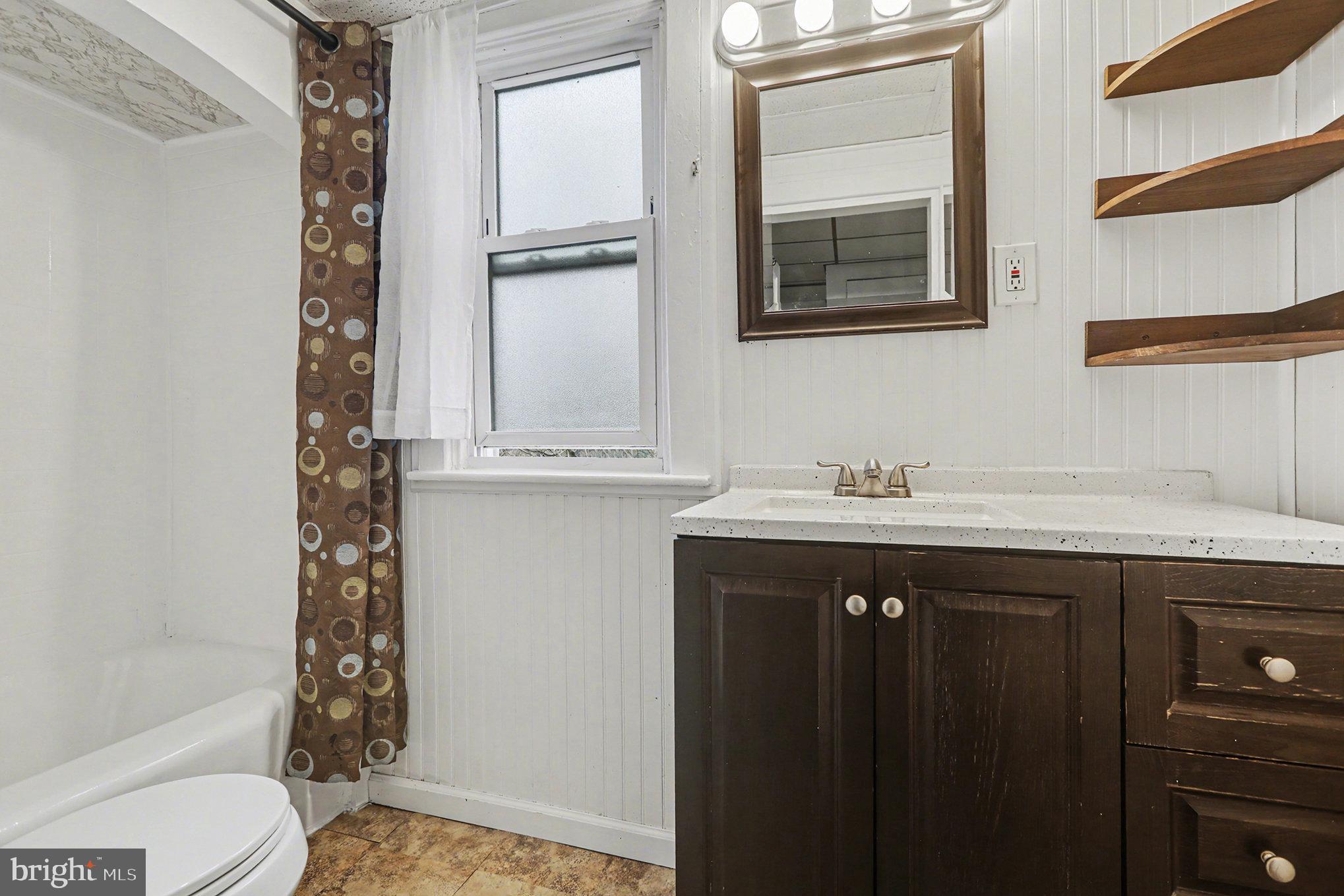 458 Highland Street Harrisburg, PA 17113 - Photo 19 of 31 a bathroom with a sink a toilet and shower