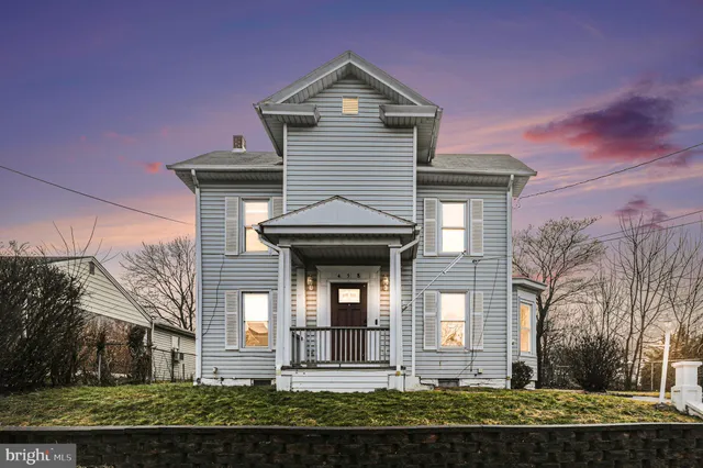 front view of a house with a yard