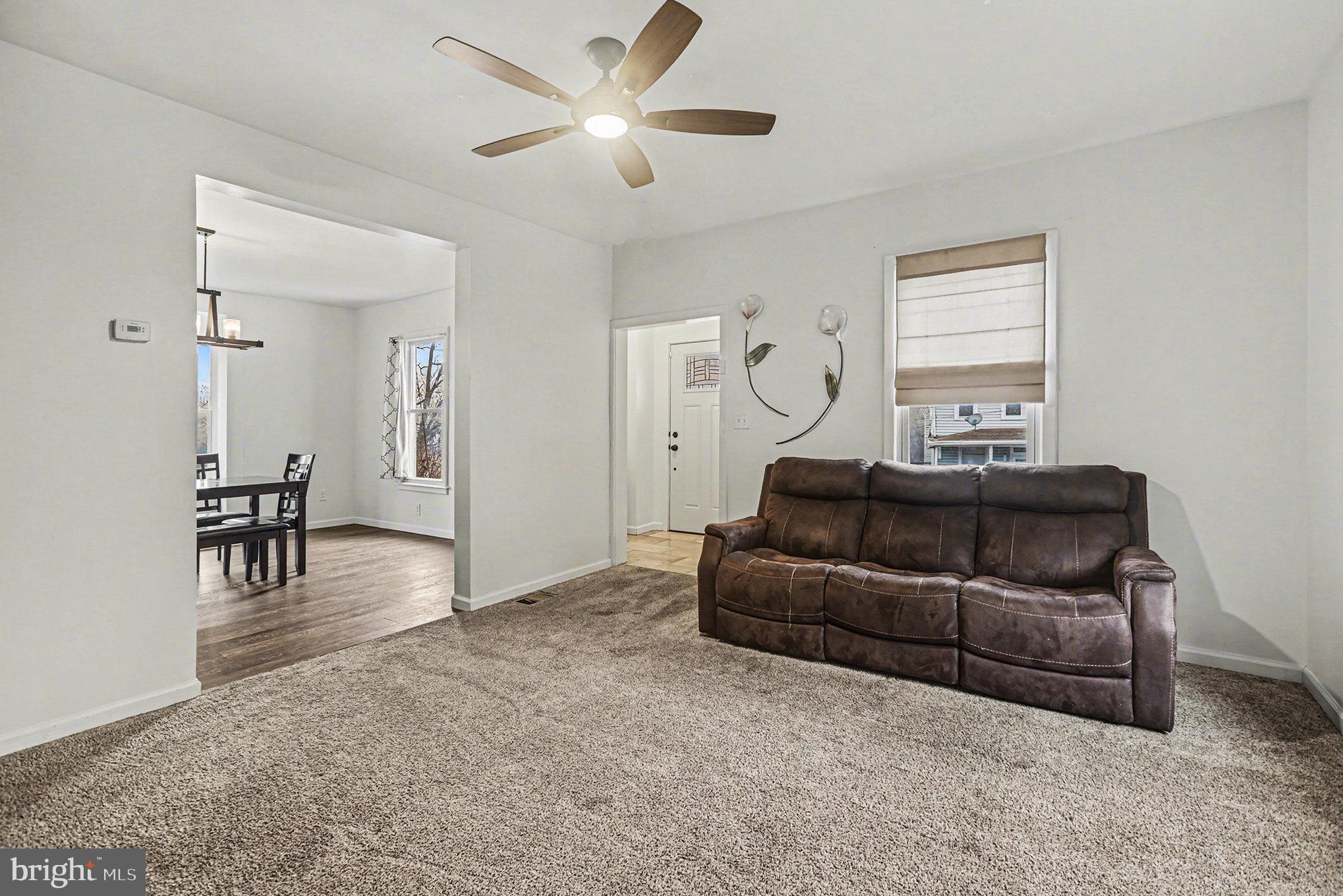 458 Highland Street Harrisburg, PA 17113 - Photo 4 of 31 a living room with furniture and a ceiling fan