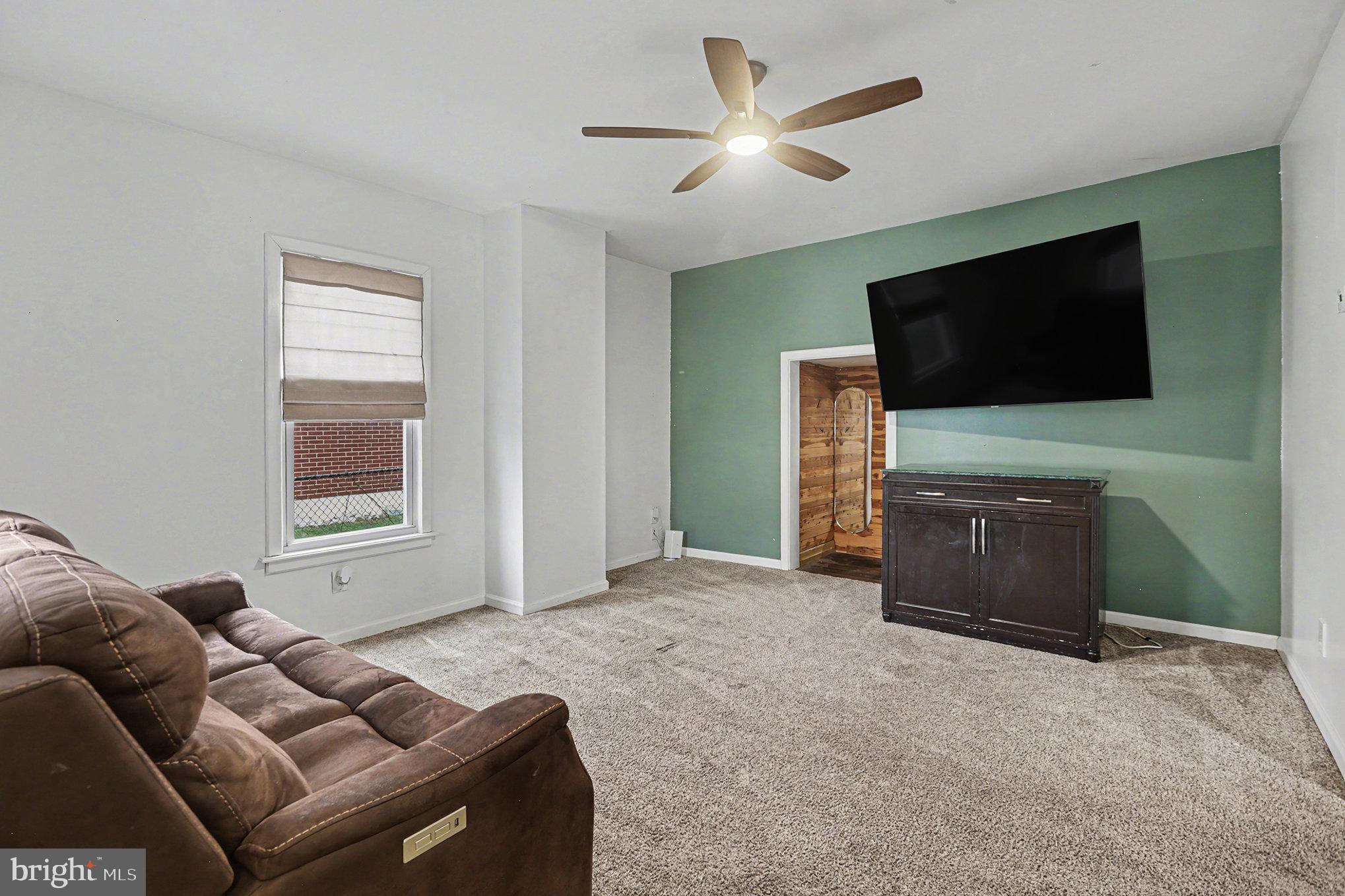 458 Highland Street Harrisburg, PA 17113 - Photo 5 of 31 a living room with furniture and a flat screen tv