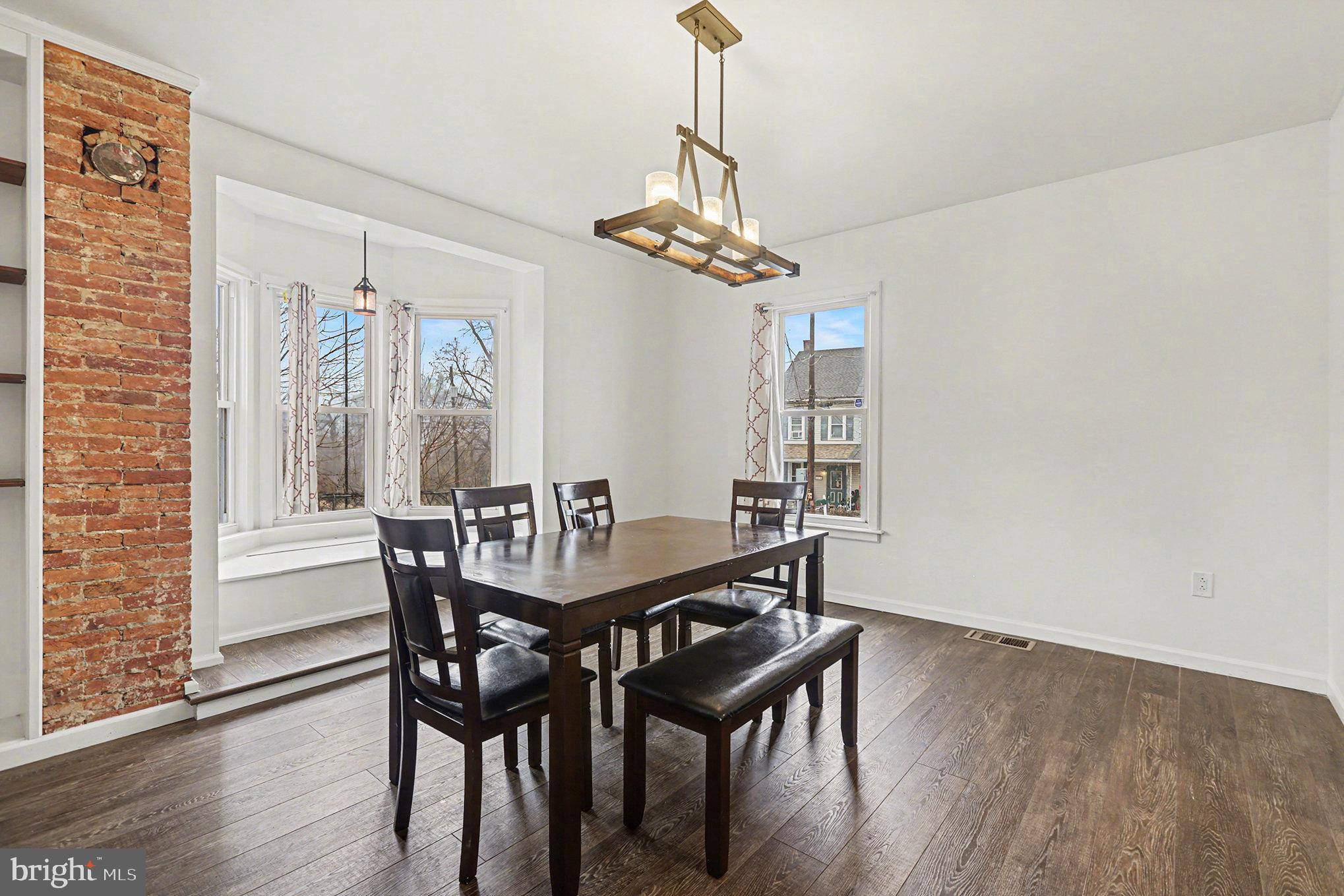 458 Highland Street Harrisburg, PA 17113 - Photo 6 of 31 a view of a dining room with furniture window and wooden floor