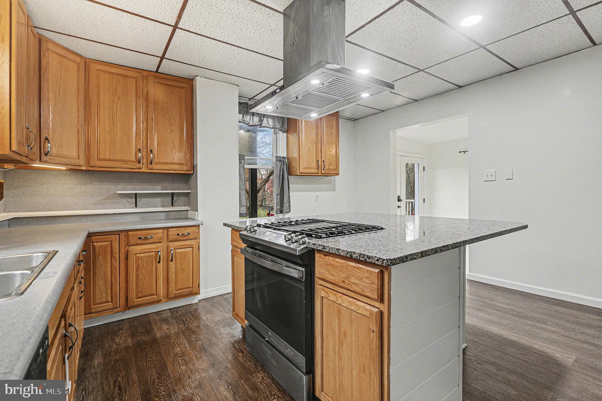 458 Highland Street Harrisburg, PA 17113 - Photo 10 of 31 a kitchen with stainless steel appliances granite countertop a stove and a sink