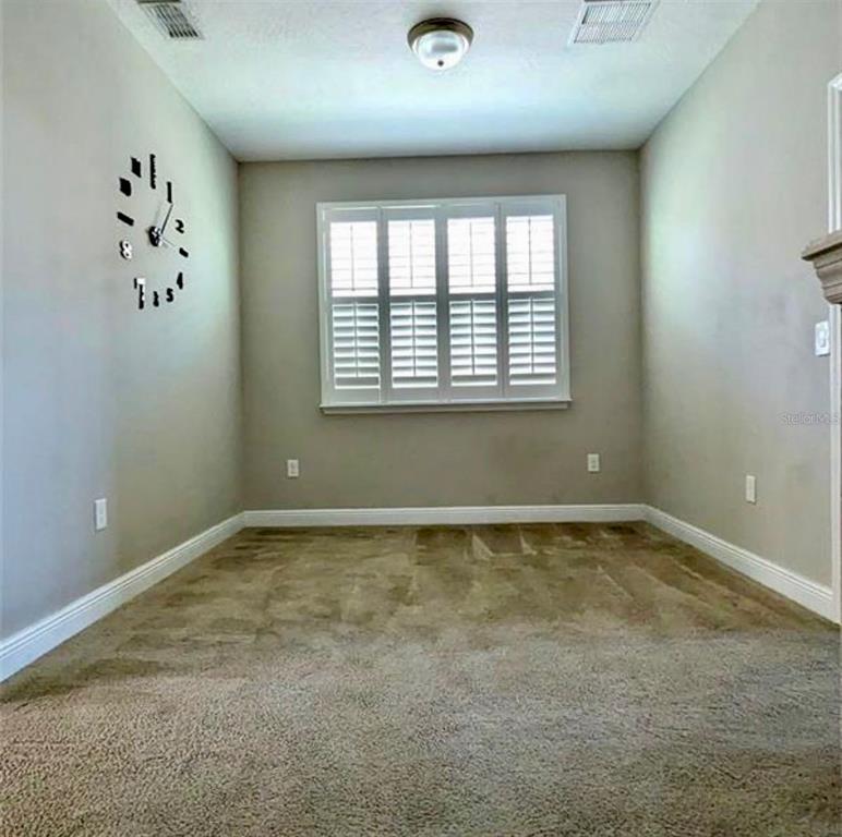 8582 Powder Ridge Trail Windermere, FL 34786 - Photo 20 of 37 a view of an empty room with a window