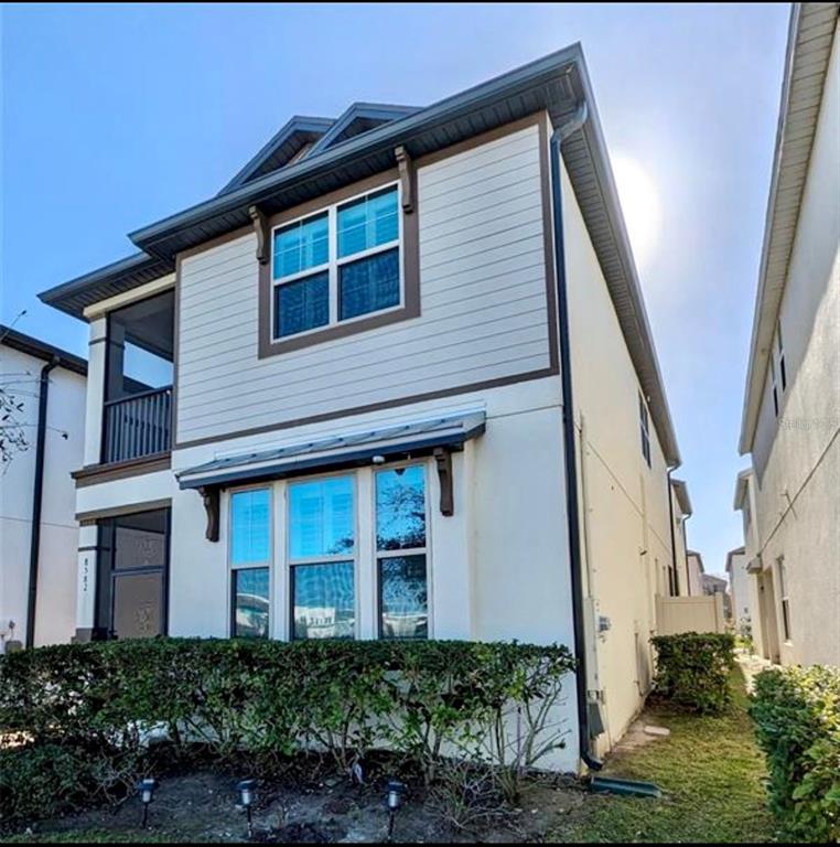 8582 Powder Ridge Trail Windermere, FL 34786 - Photo 2 of 37 a front view of a house with a yard