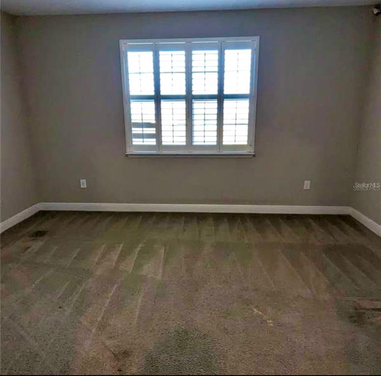 8582 Powder Ridge Trail Windermere, FL 34786 - Photo 25 of 37 a view of an empty room with a window