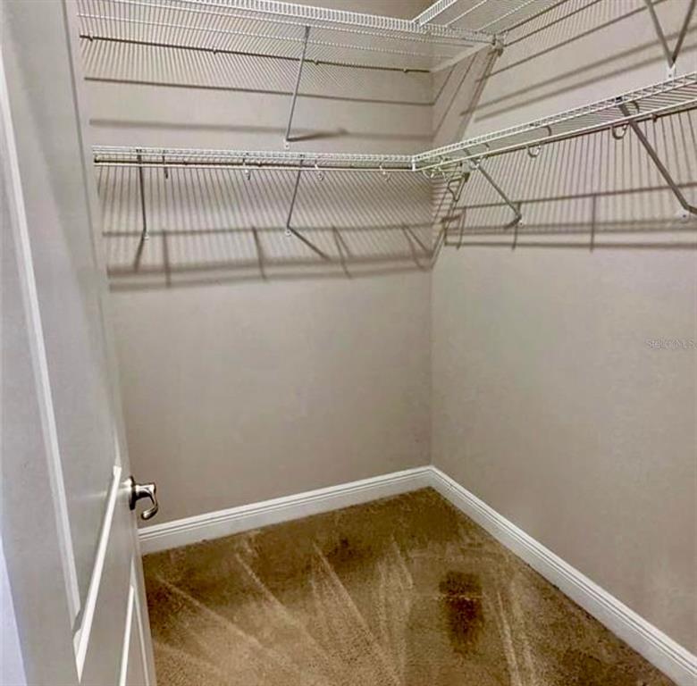 8582 Powder Ridge Trail Windermere, FL 34786 - Photo 28 of 37 a view of a room with racks on the wall