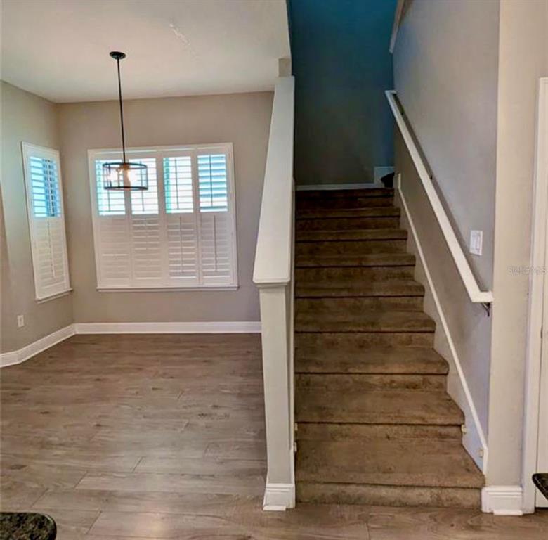 8582 Powder Ridge Trail Windermere, FL 34786 - Photo 10 of 37 a view of an entryway with wooden floor