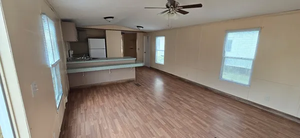 a view of room with window and hardwood floor