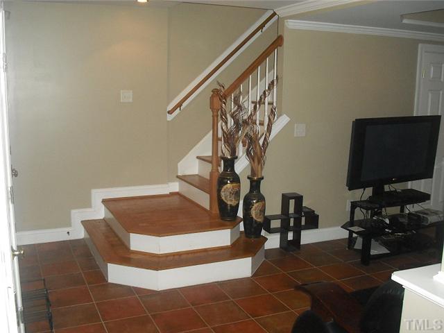 2209 Rock Quarry Road Raleigh, NC 27610 - Photo 13 of 25 a living room with furniture and a flat screen tv