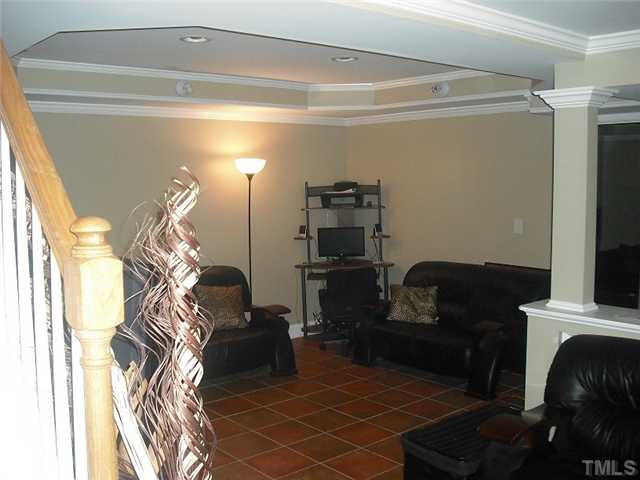 2209 Rock Quarry Road Raleigh, NC 27610 - Photo 14 of 25 a living room with furniture and a fireplace