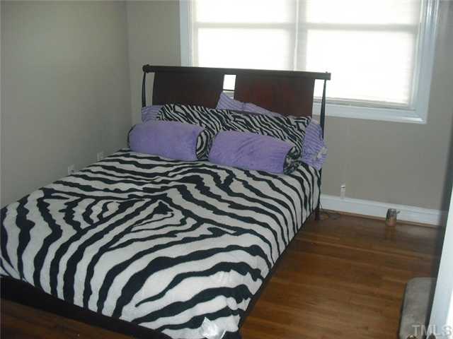 2209 Rock Quarry Road Raleigh, NC 27610 - Photo 17 of 25 a bedroom with a bed and window