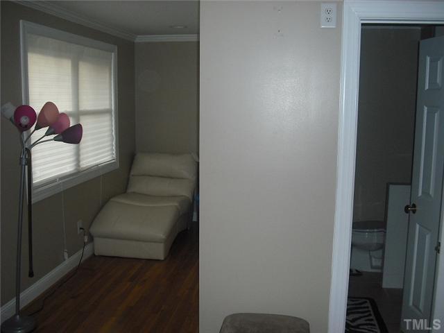 2209 Rock Quarry Road Raleigh, NC 27610 - Photo 18 of 25 a living room with furniture and a potted plant