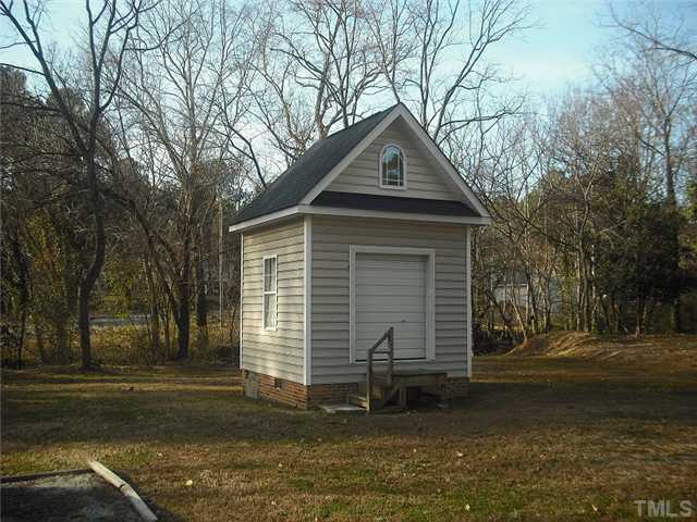 2209 Rock Quarry Road Raleigh, NC 27610 - Photo 20 of 25 a front view of a house with a yard