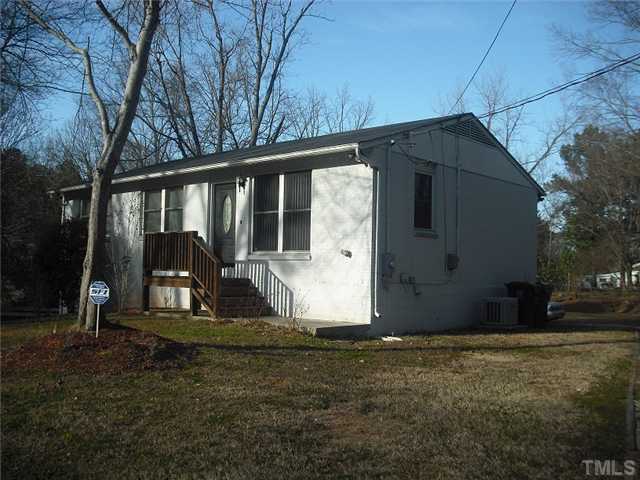 2209 Rock Quarry Road Raleigh, NC 27610 - Photo 2 of 25 a view of a back yard of the house