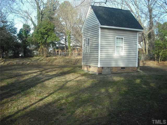 2209 Rock Quarry Road Raleigh, NC 27610 - Photo 21 of 25 a view of backyard of house with green space
