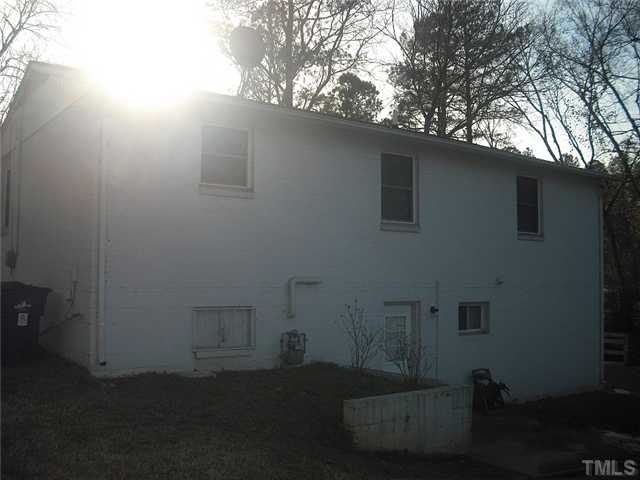 2209 Rock Quarry Road Raleigh, NC 27610 - Photo 4 of 25 a backyard of a house with lots of green space