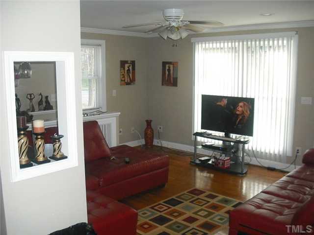 2209 Rock Quarry Road Raleigh, NC 27610 - Photo 5 of 25 a living room with furniture and a flat screen tv