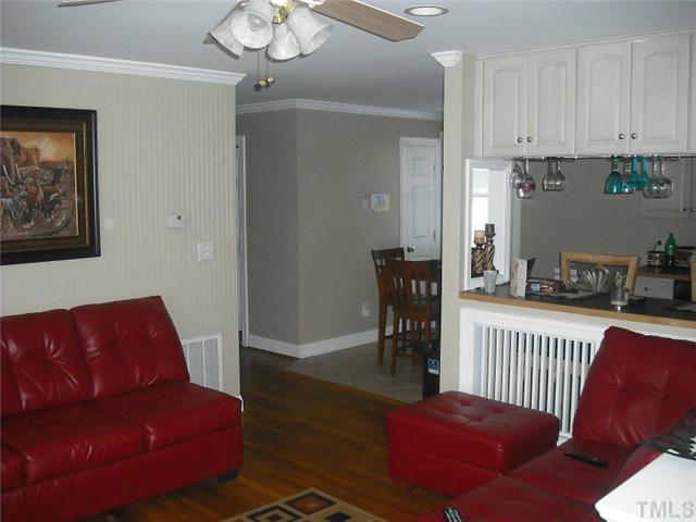 2209 Rock Quarry Road Raleigh, NC 27610 - Photo 7 of 25 a living room with furniture a couch and a dining table