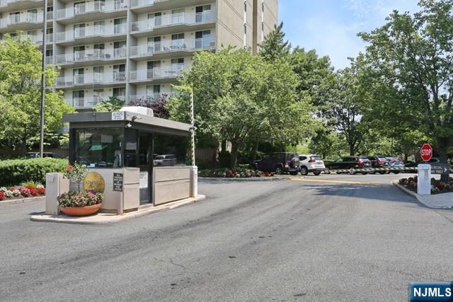 1055 River, Unit 506 Edgewater, NJ 07020 - Photo 18 of 25 a view of a street with a building and couple of cars parked in front of it