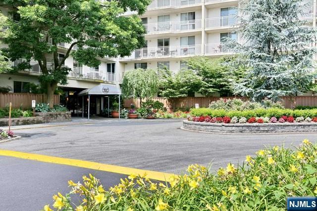 1055 River, Unit 506 Edgewater, NJ 07020 - Photo 19 of 25 a view of a swimming pool with an outdoor seating