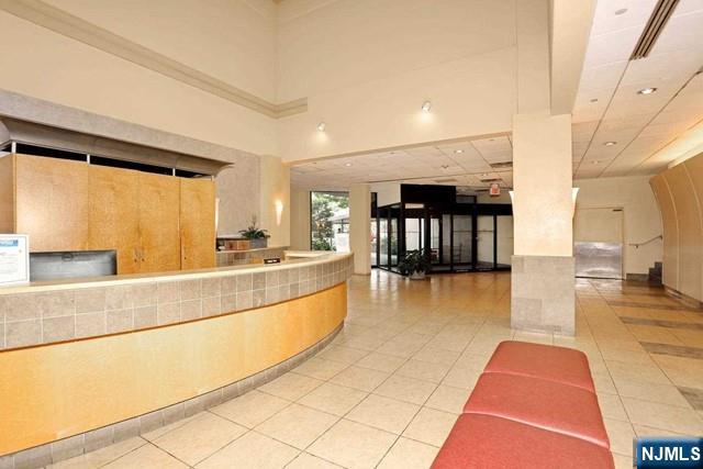 1055 River, Unit 506 Edgewater, NJ 07020 - Photo 21 of 25 a large white kitchen with a large window
