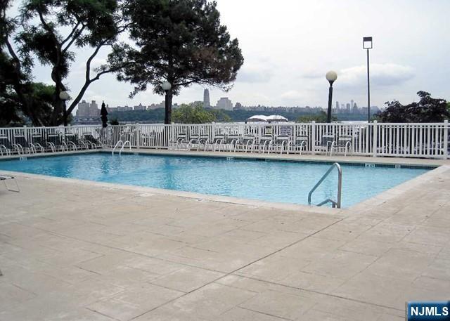 1055 River, Unit 506 Edgewater, NJ 07020 - Photo 23 of 25 a view of a lake with a terrace