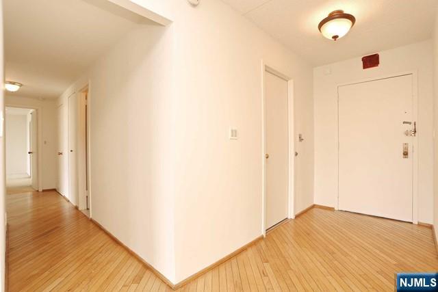 1055 River, Unit 506 Edgewater, NJ 07020 - Photo 10 of 25 a view of hallway with wooden floor