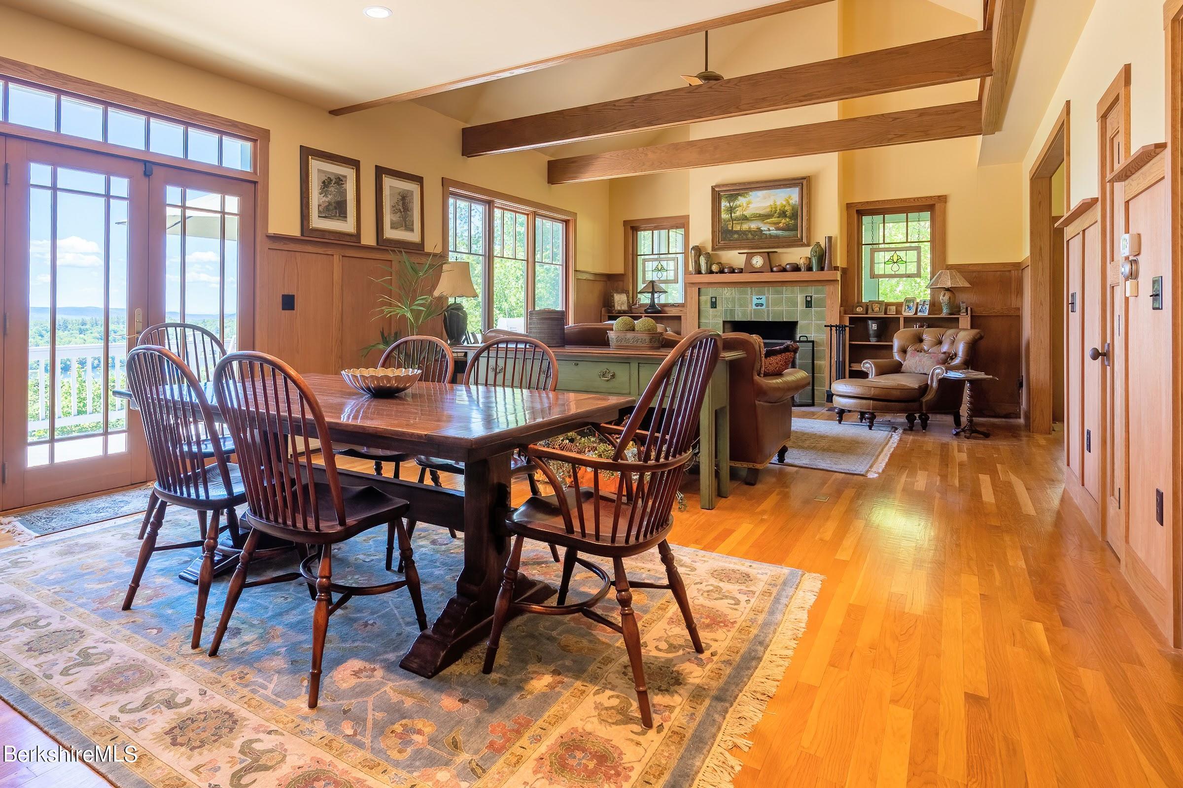99 Hupi Road Monterey, MA 01245 - Photo 11 of 43 a view of a dining room with furniture window and wooden floor