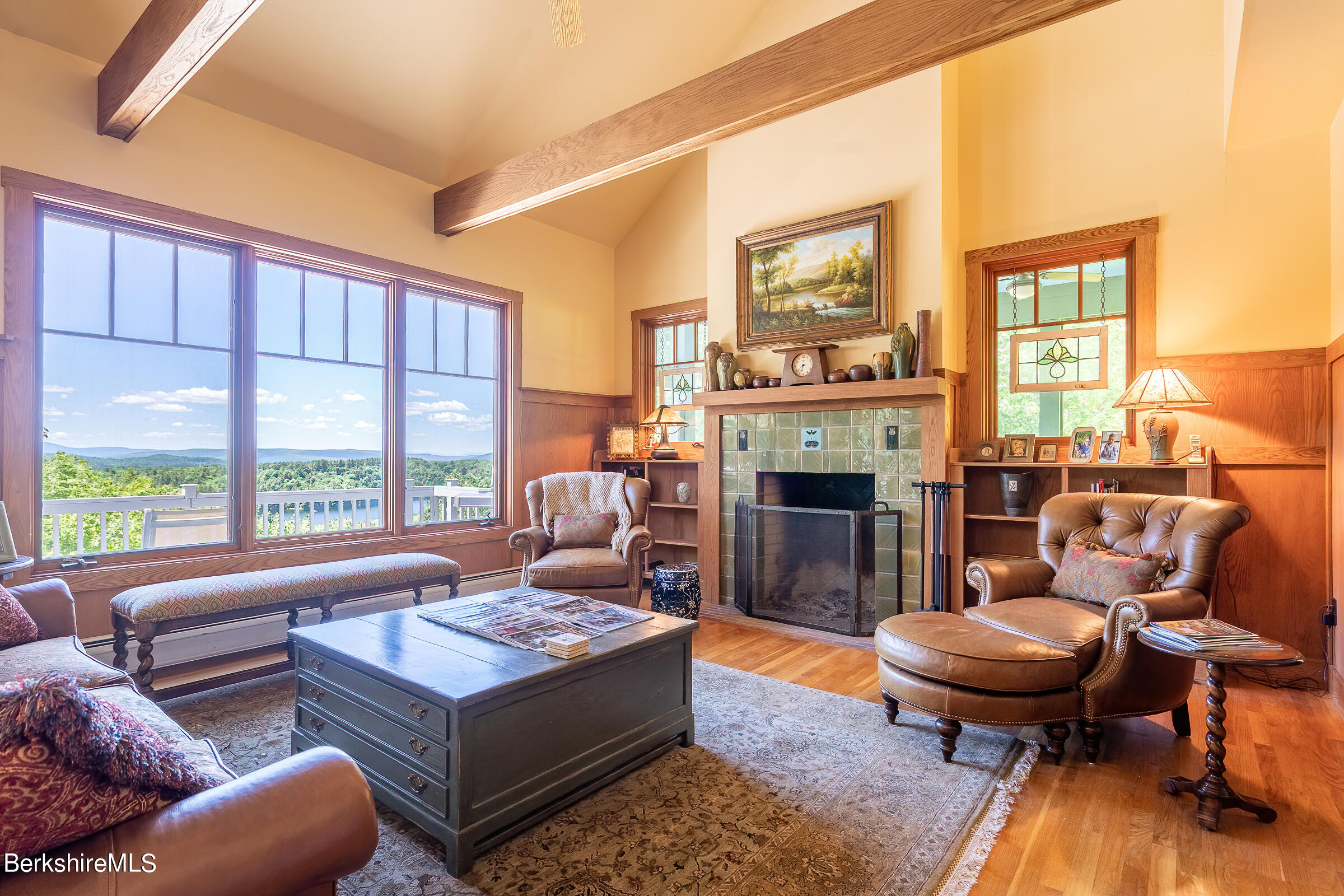 99 Hupi Road Monterey, MA 01245 - Photo 13 of 43 a living room with furniture a large window and a fireplace