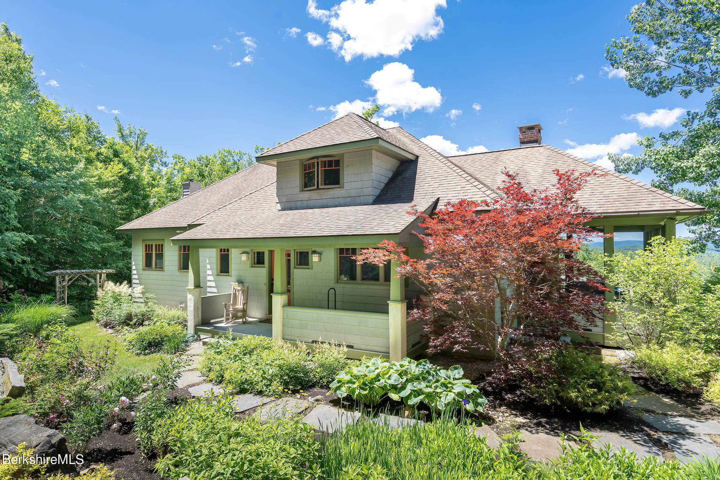 99 Hupi Road Monterey, MA 01245 - Photo 2 of 43 a front view of a house with garden