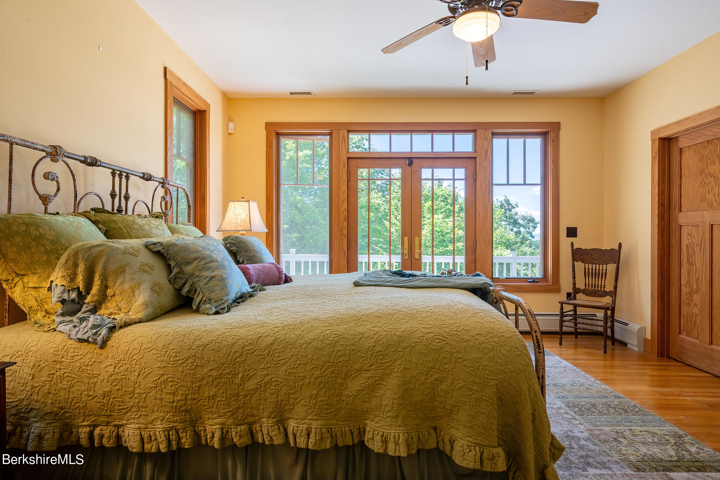 99 Hupi Road Monterey, MA 01245 - Photo 21 of 43 a bed sitting in a bedroom next to a window