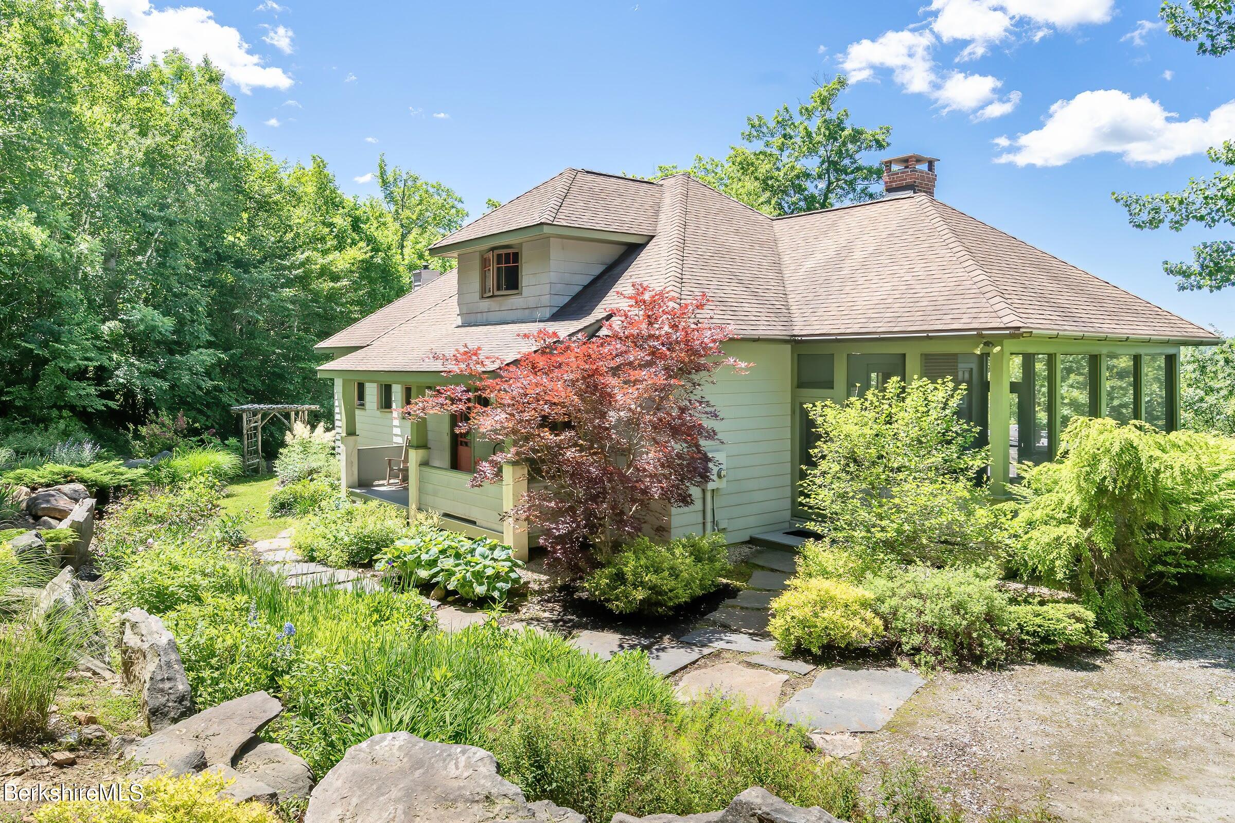 99 Hupi Road Monterey, MA 01245 - Photo 37 of 43 a front view of a house with a yard