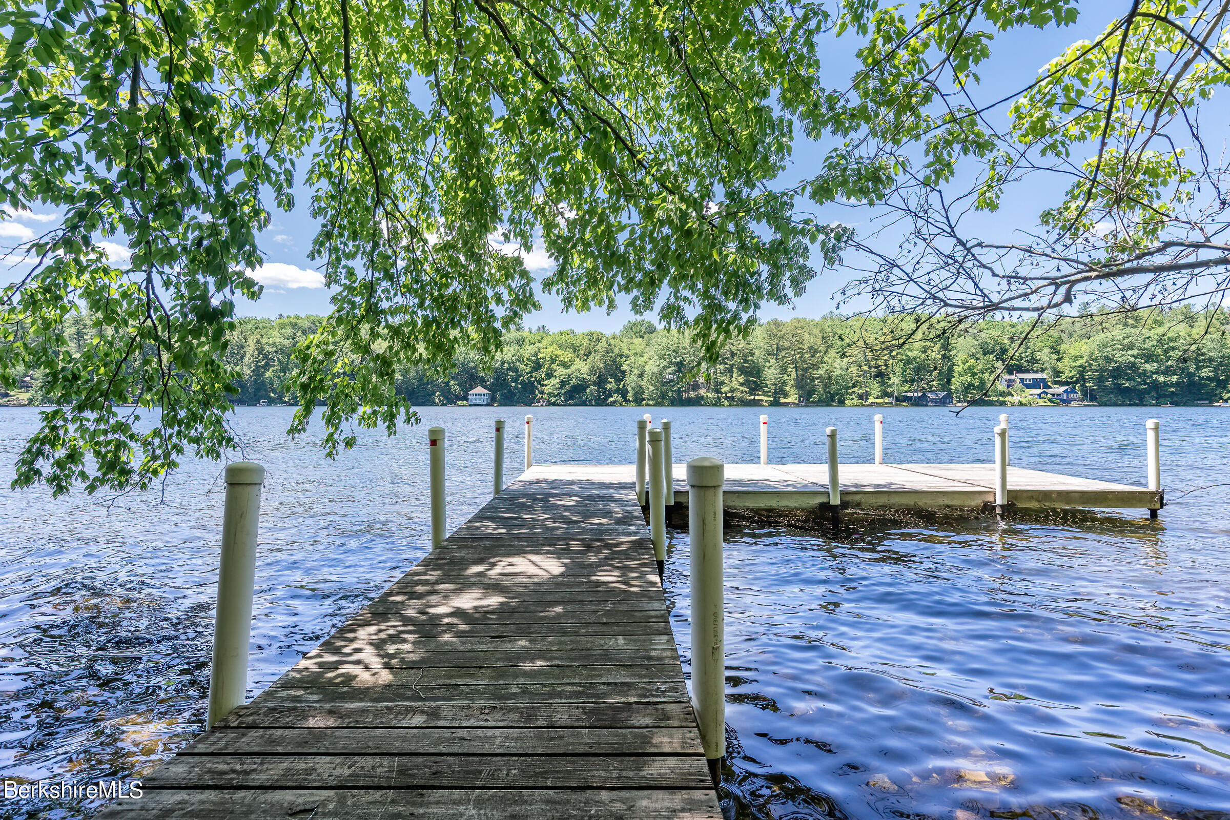 99 Hupi Road Monterey, MA 01245 - Photo 6 of 43 a backyard of a house with lots of green space