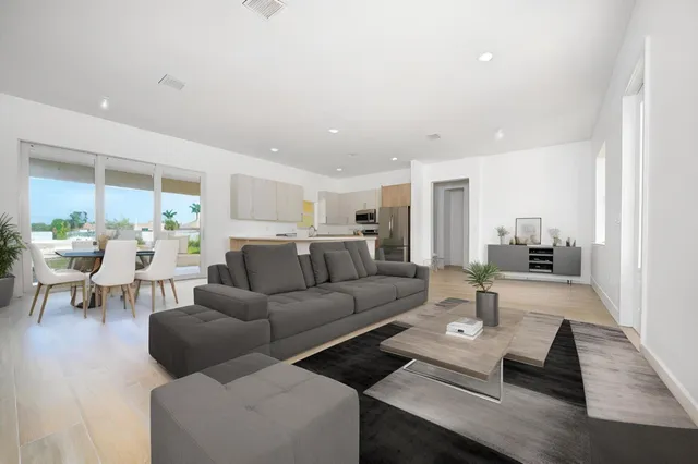 a living room with furniture and a table