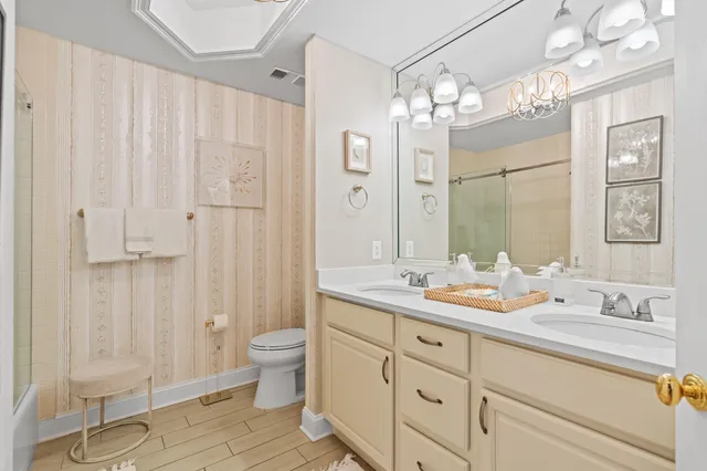 a bedroom with furniture and flat screen tv