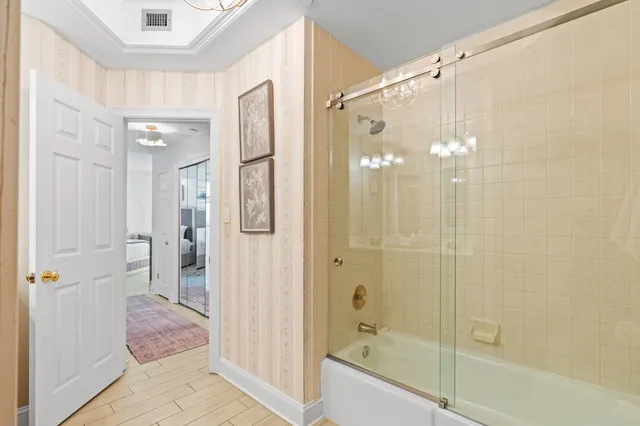 a bedroom with two bed and a flat screen tv