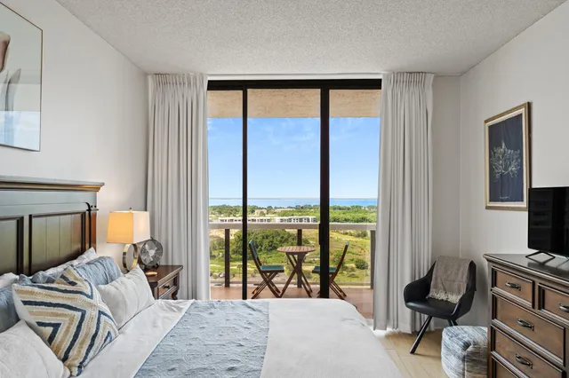 a bedroom with a bed and a view of bedroom