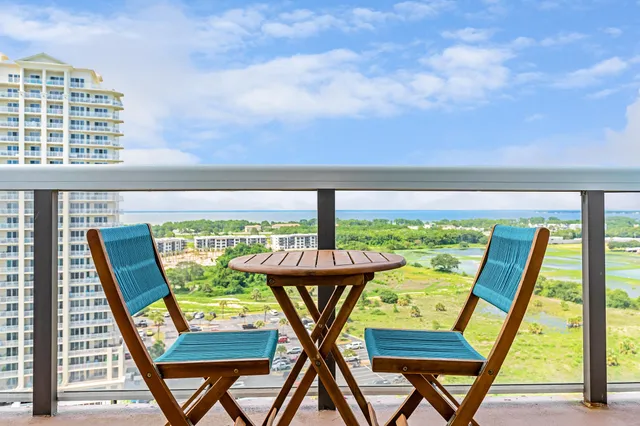 a bathroom with a shower a sink and mirror