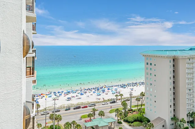 a living room with furniture and a large mirror