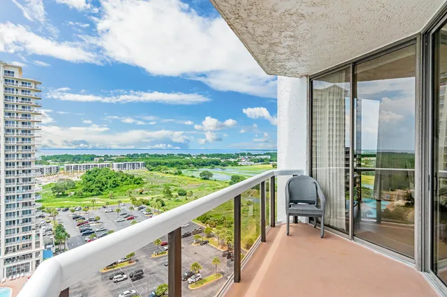 a view of a balcony with chairs
