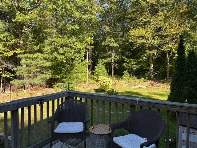 a view of a chair and table on the wooden floor