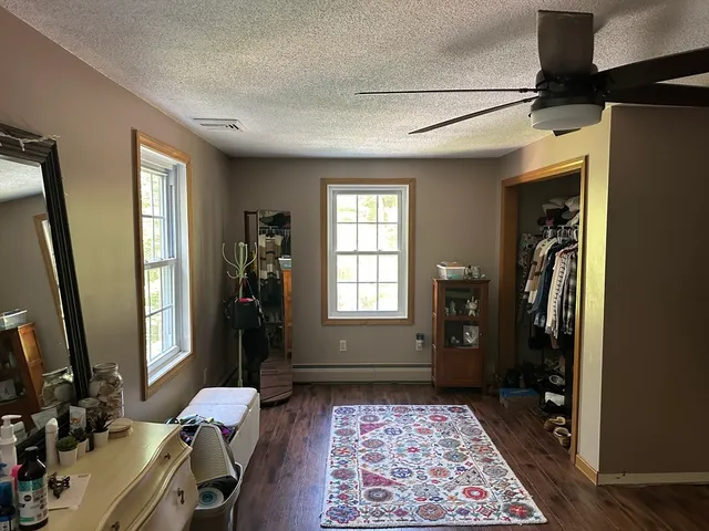 a bathroom with a sink a mirror and a shower