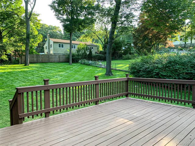a view of deck with wooden floor and fence