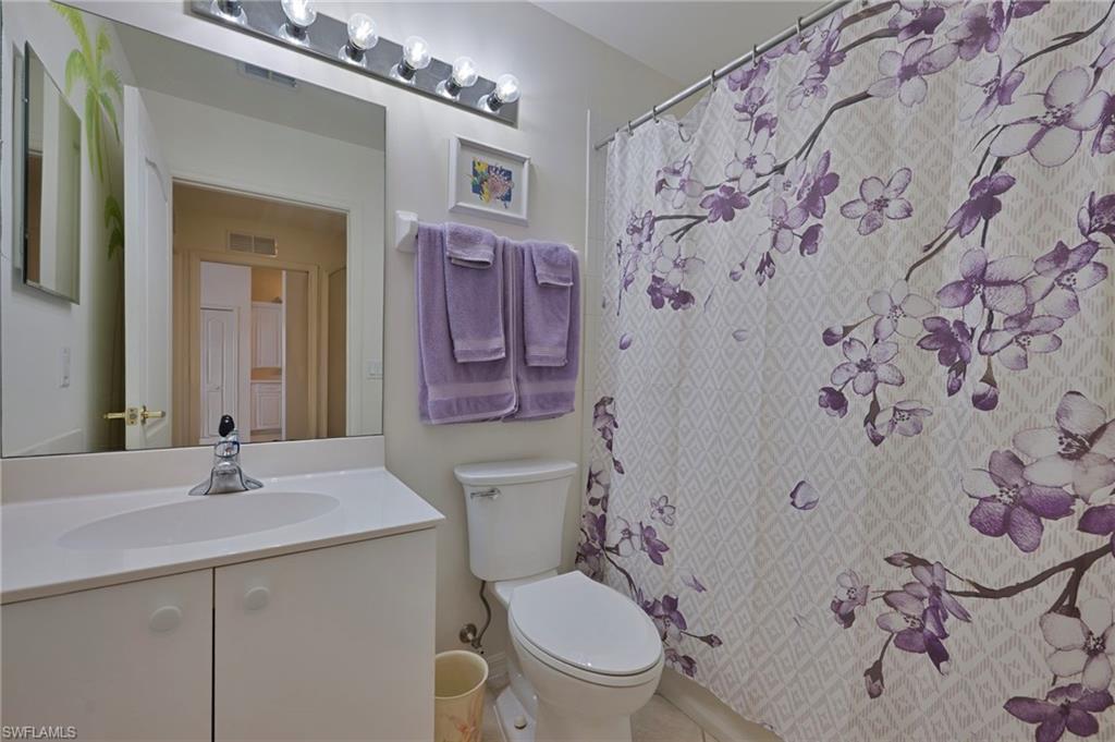 3890 Sawgrass Way, Unit 2324 Naples, FL 34112 - Photo 15 of 18 Guest Bathroom with Shower and Bathtub