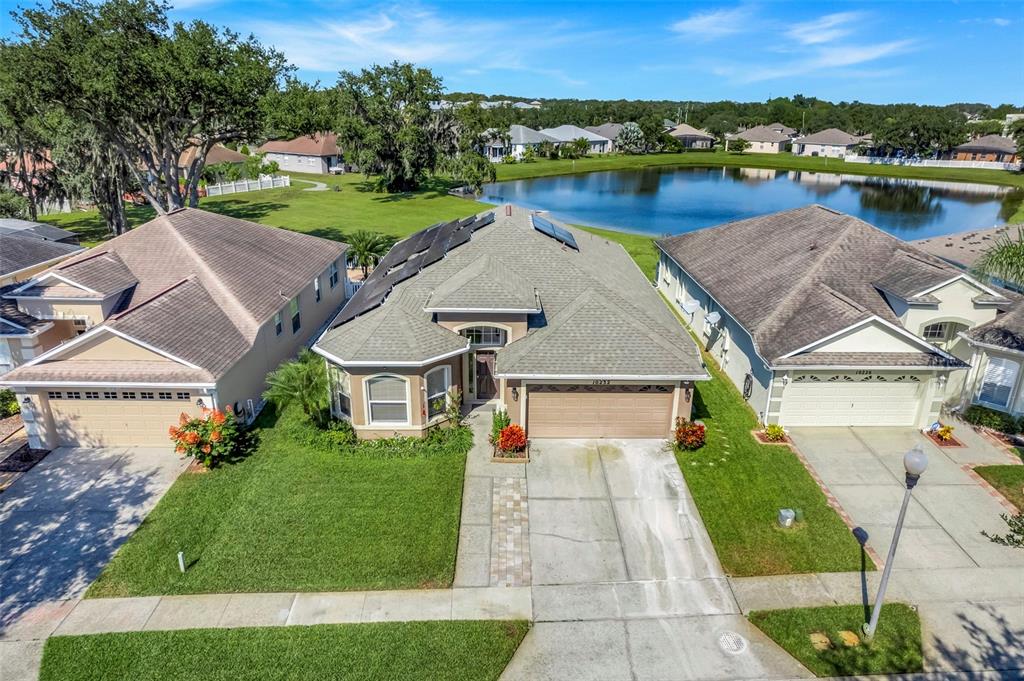 an aerial view of a house with a yard and a garden