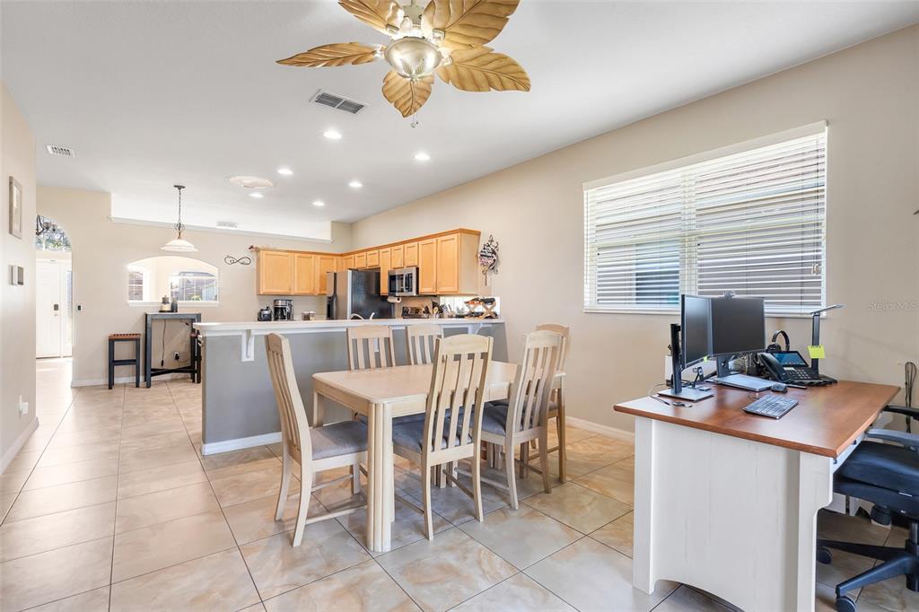 10232 Andover Point Circle Orlando, FL 32825 - Photo 7 of 33 a view of a dining room with furniture