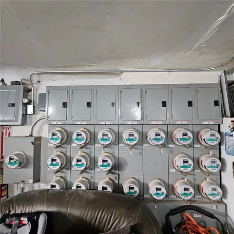 a bedroom with a bed and a tv