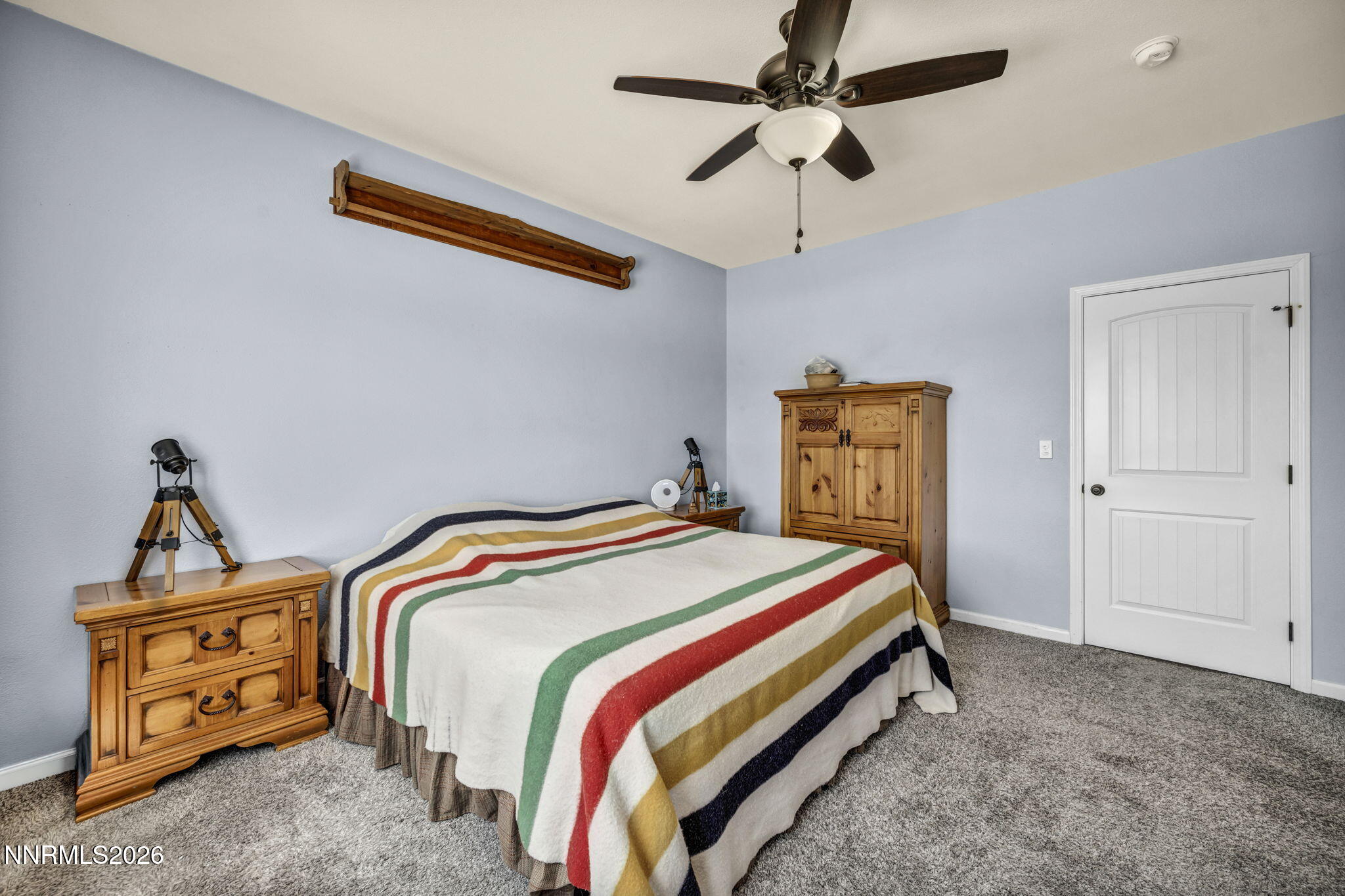 1286 Sky Ridge Drive Fallon, NV 89406 - Photo 28 of 49 a bedroom with bed and wooden floor